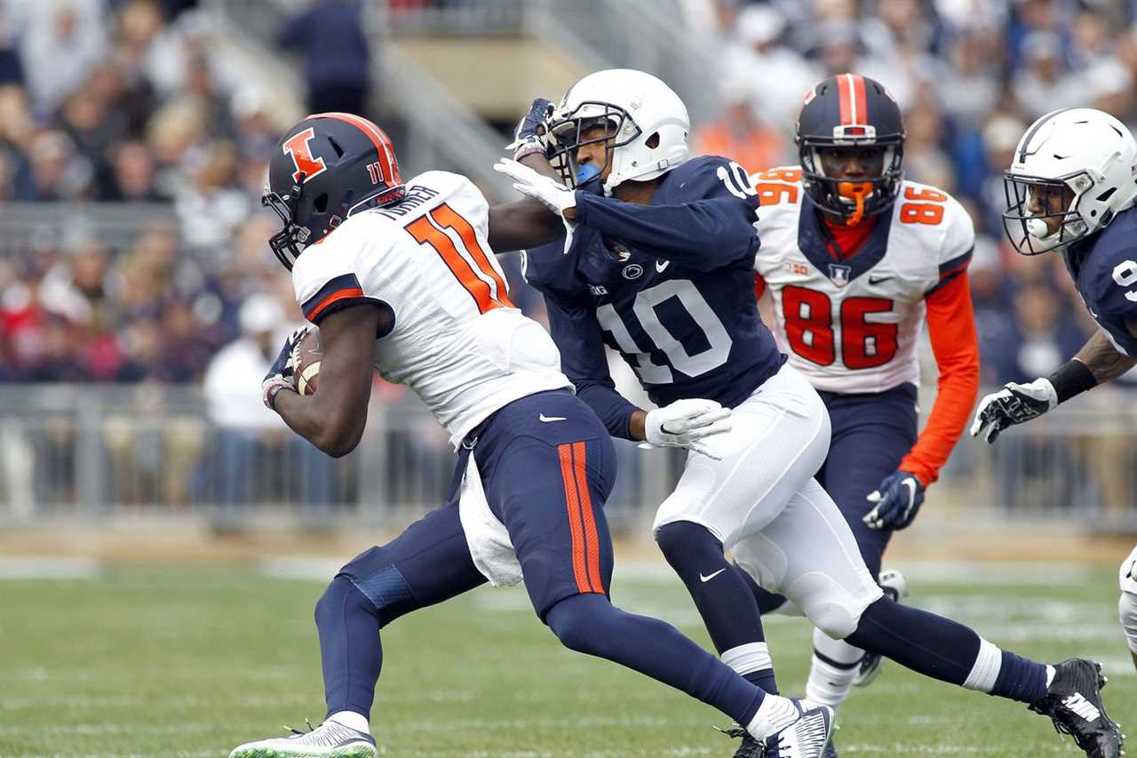 Trevor Williams of Penn State tackles Malik Turner of Illinois