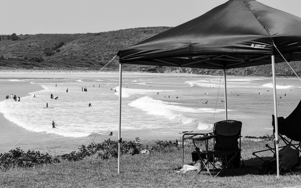 A canopy tent above a beach.