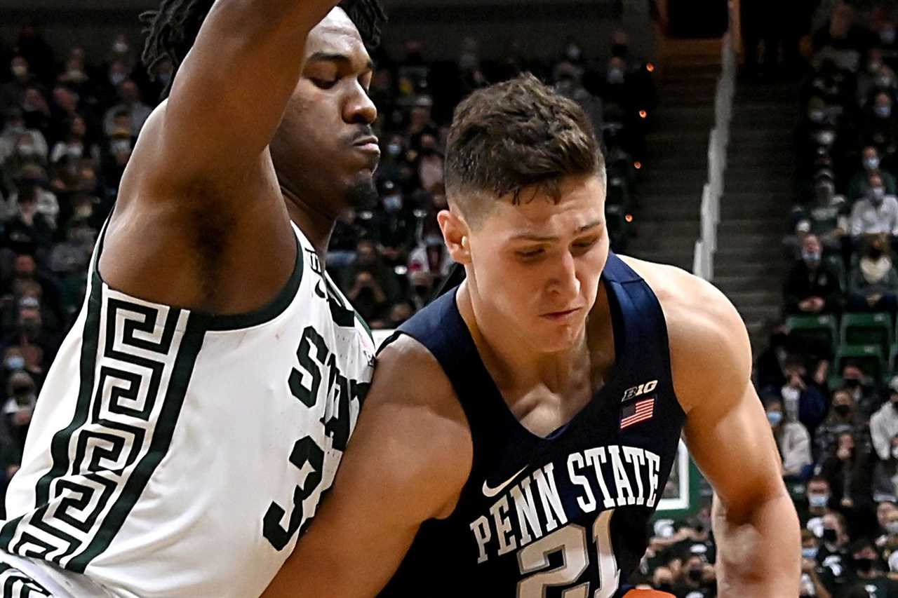 Penn State Nittany Lions forward John Harrar (21) works in the paint against Michigan State Spartans forward Julius Marble II (34) in the first half at Jack Breslin Student Events Center