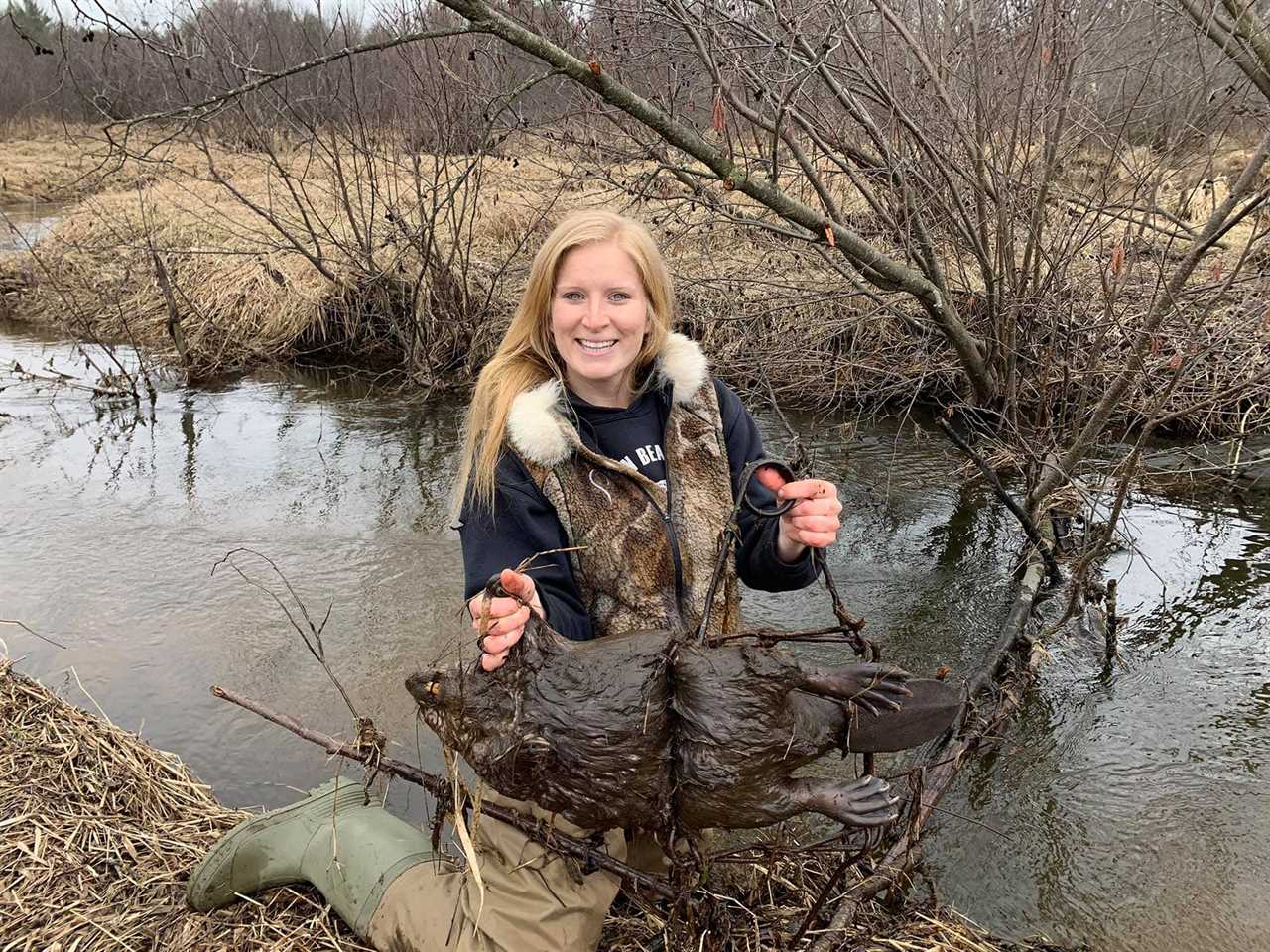 A trapper with a beaver.