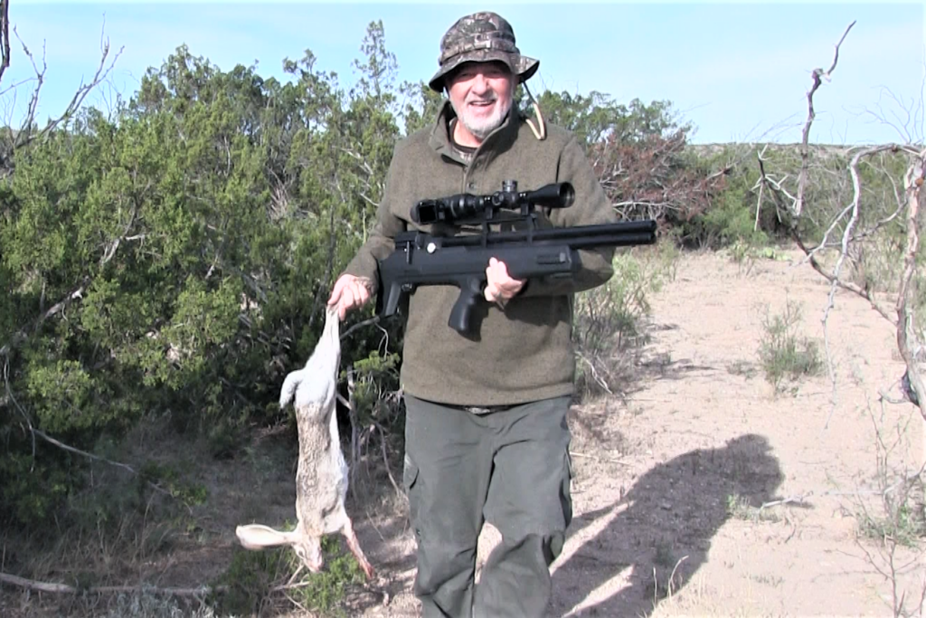 The author holding the Air Venturi Avenger Bullpup and a rabbit 