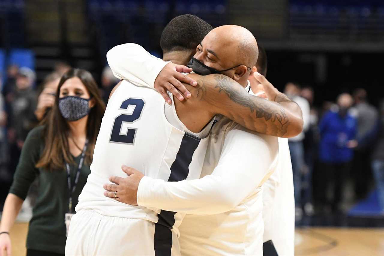 Head coach Micah Shrewsberry and Myles Dread #2 of the Penn State Nittany Lions celebrate a win after a college basketball game against the Indiana Hoosiers at the Bryce Jordan Center on January 2, 2022 in University Park, Pennsylvania.