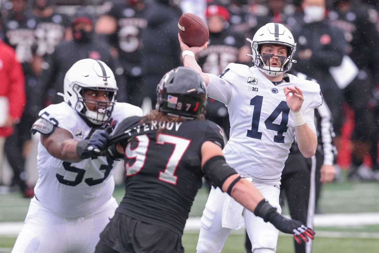 Penn State quarterback Sean Clifford (14) throws the ball as Rutgers Scarlet Knights defensive lineman Mike Tverdov (97) is flicked by offensive lineman Rasheed Walker (53) during the first half at SHI Stadium.