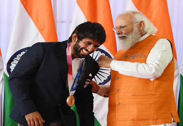 In Pics: Tokyo Olympics gold medallist Neeraj Chopra presents his signed javelin to PM Modi; PV Sindhu has ice-cream with Prime Minister