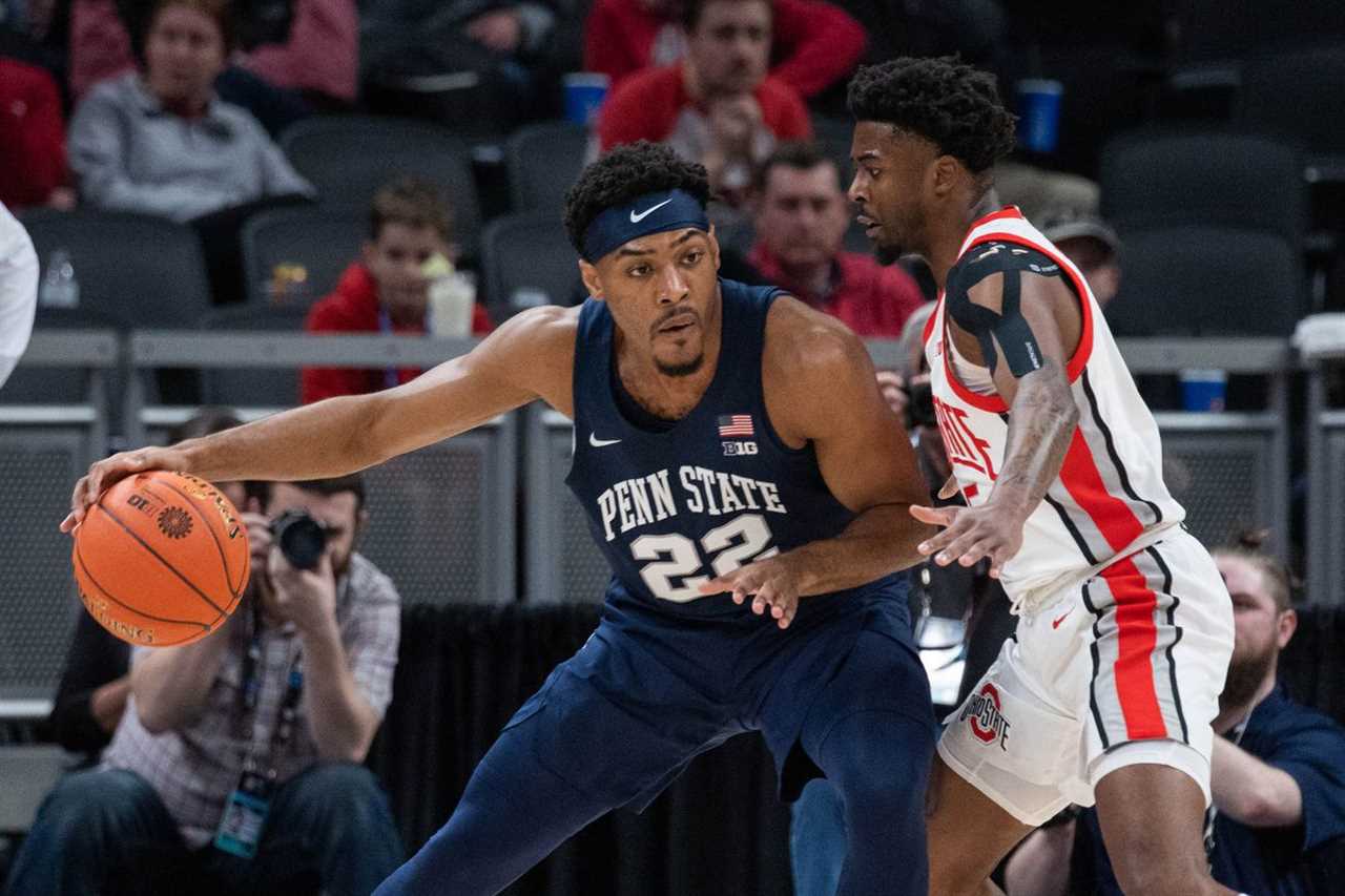 Penn State Nittany Lions guard Jalen Pickett (22) dribbles the ball while Ohio State Buckeyes guard Jamari Wheeler (55) defends in the first half at Gainbridge Fieldhouse.