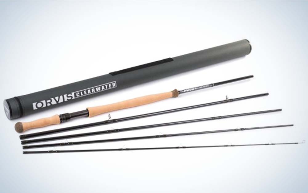 A deconstructed black best fly rod for beginners with a cork handle next to a carrying tube