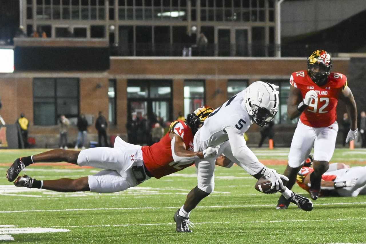 Penn State Nittany Lions wide receiver Jahan Dotson (5) dives for extra yards as Maryland Terrapins defensive back Jakorian Bennett (2) defends during the second half at Capital One Field at Maryland Stadium.