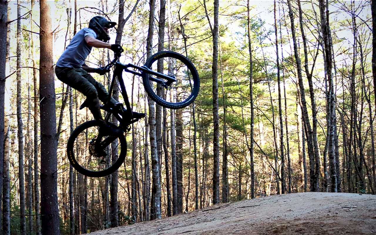 A man going off a jump on a best mountain bike