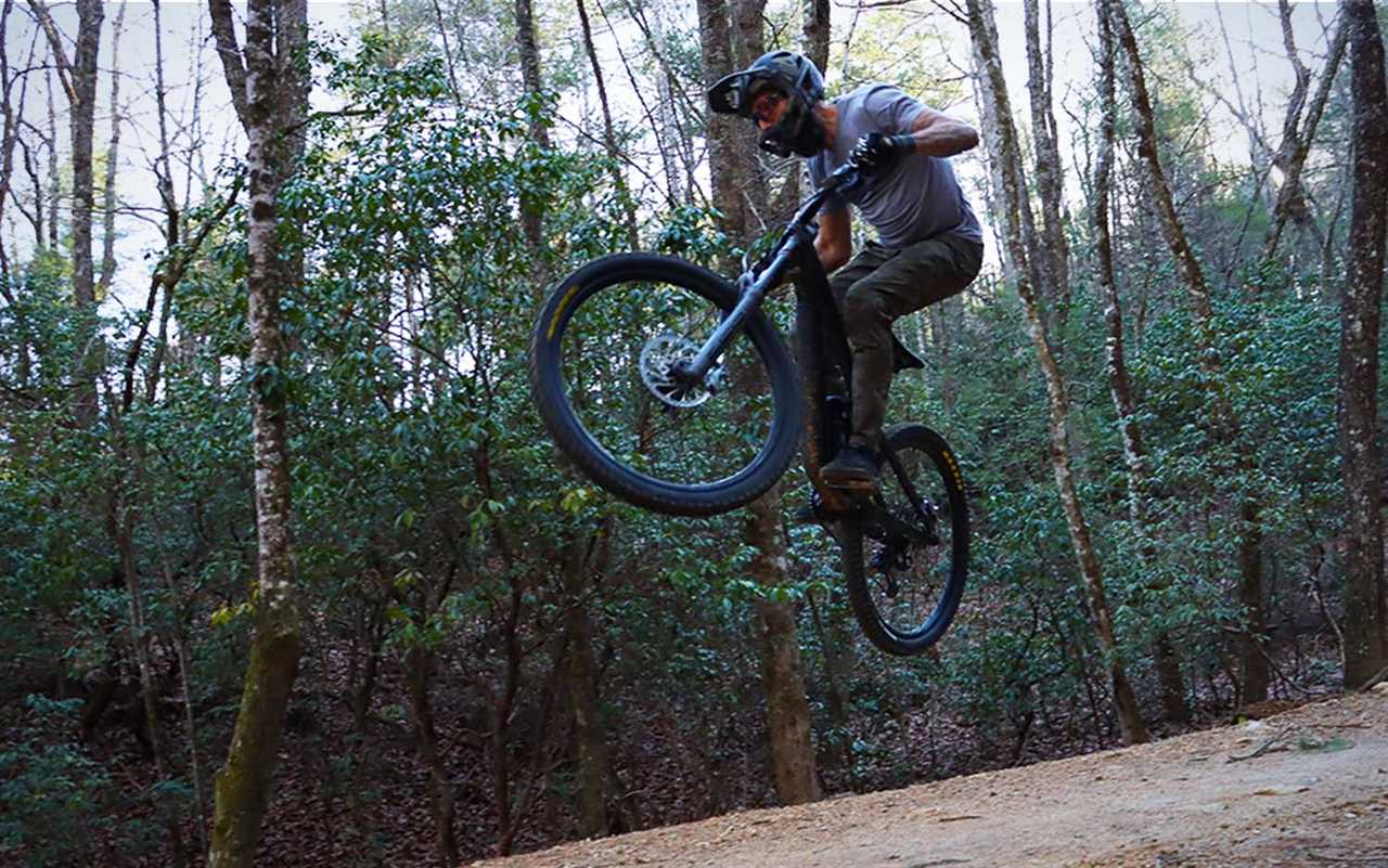 A man going off a jump on a best mountain bike