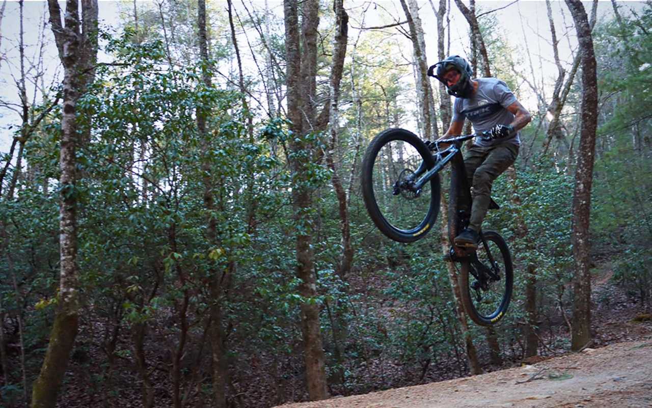 A man going off a jump on a best mountain bike