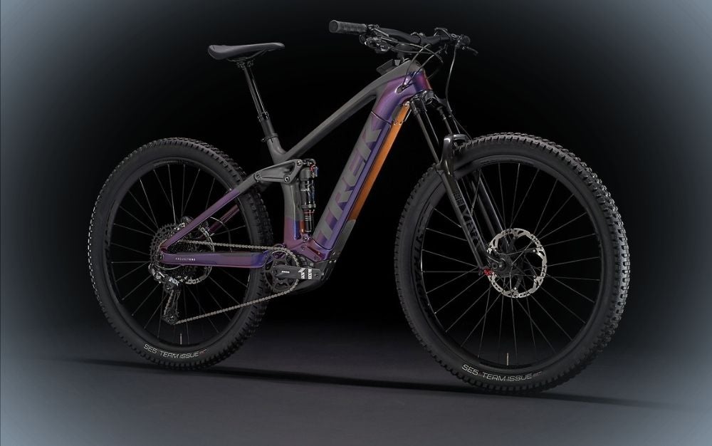 A purple best mountain bike with black wheels