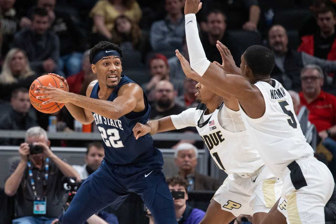 Penn State Nittany Lions guard Jalen Pickett (22) looks to pass the ball while Purdue Boilermakers players defend in the second half at Gainbridge Fieldhouse.