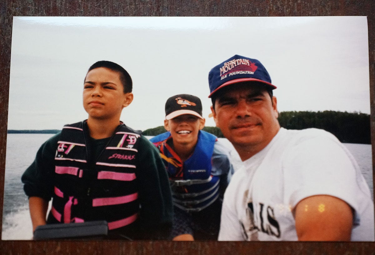 Father and sons fishing.