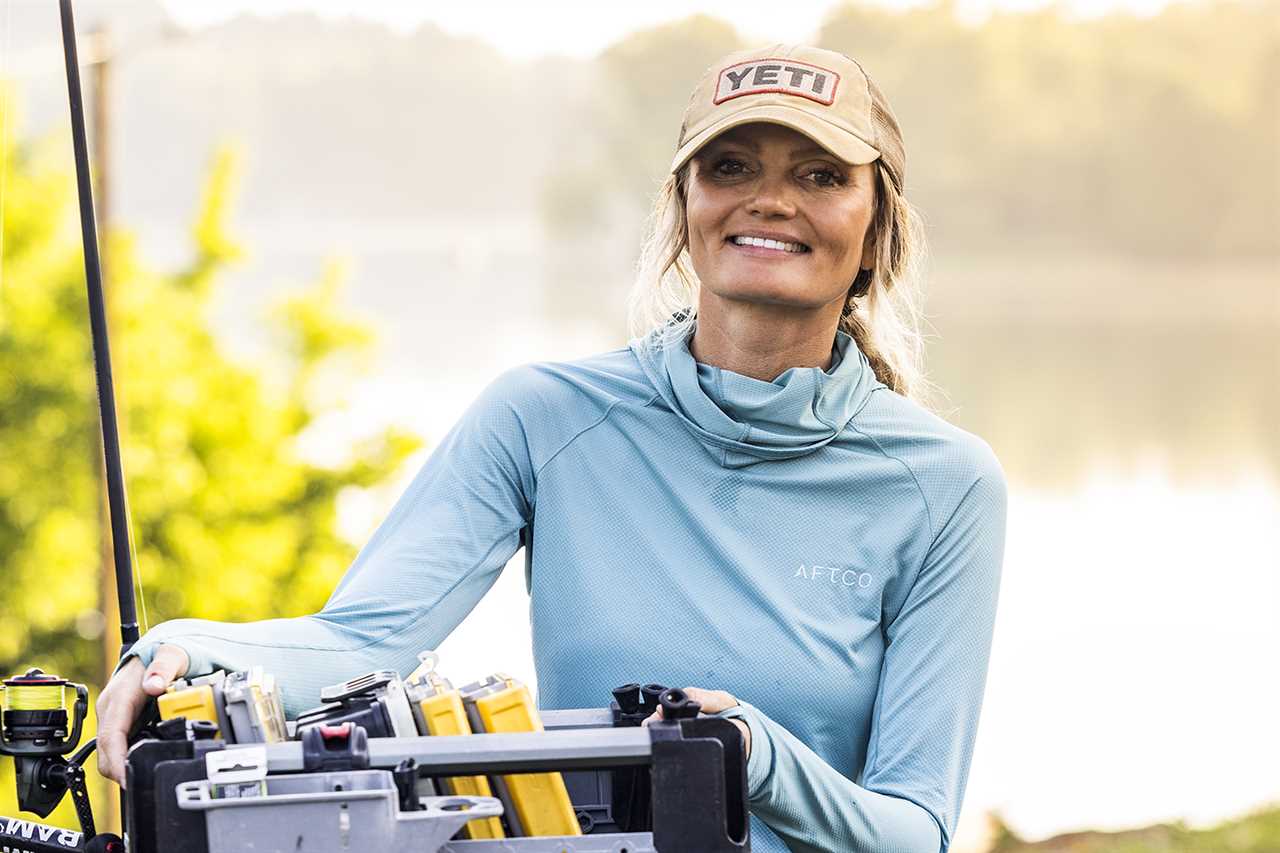 Angler unloads tackle boxes