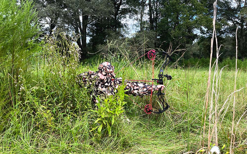 The ASAT leafy suit in a grassy field.