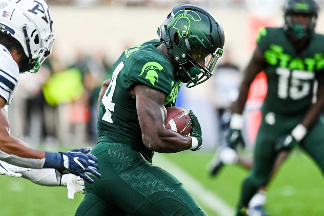 Michigan State’s Elijah Collins runs for a gain against Akron during the third quarter on Saturday, Sept. 10, 2022, at Spartan Stadium in East Lansing.