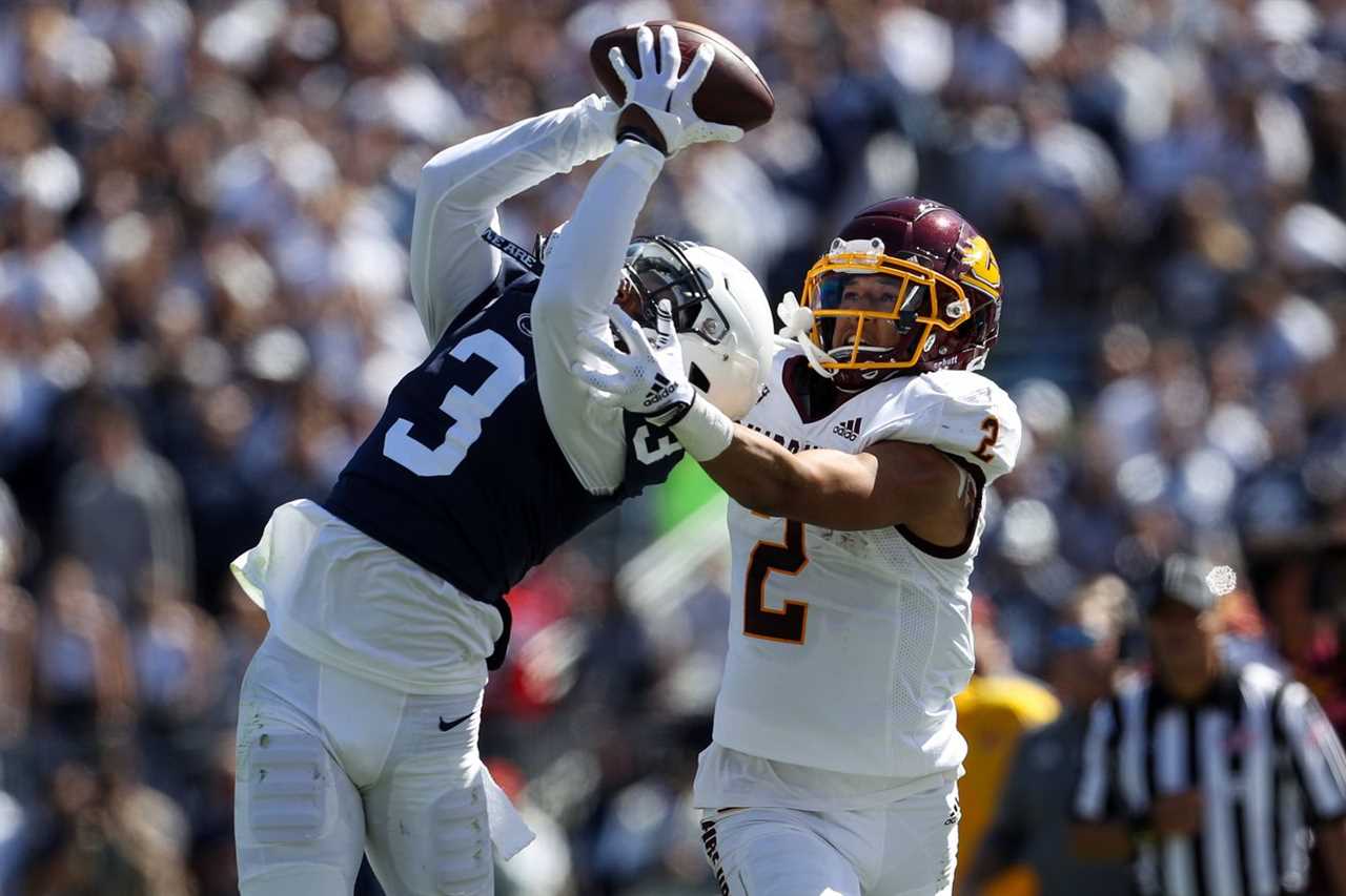 Sep 24, 2022; University Park, Pennsylvania, USA; Penn State Nittany Lions cornerback Johnny Dixon (3) intercepts the ball intended for Central Michigan Chippewas wide receiver Carlos Carriere (2) during the second quarter at Beaver Stadium.