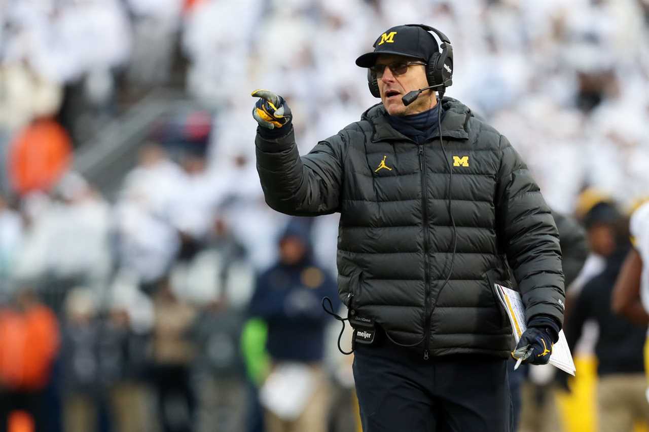 Nov 13, 2021; University Park, Pennsylvania, USA; Michigan Wolverines head coach Jim Harbaugh gestures from the sideline during the fourth quarter against the Penn State Nittany Lions at Beaver Stadium. Michigan defeated Penn State 21-17.