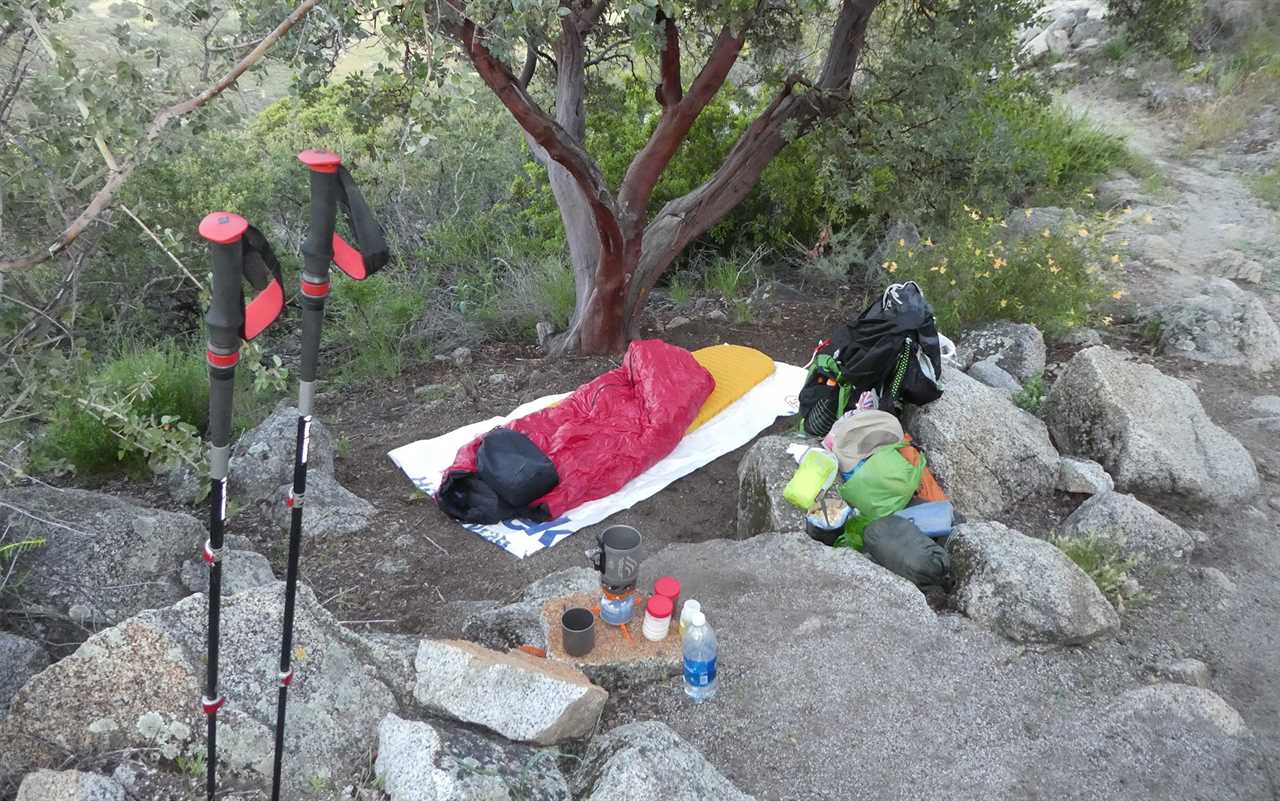 Cowboy camping or using a bivouac instead of a tent allows you to squeeze into tighter places than you might otherwise fit.