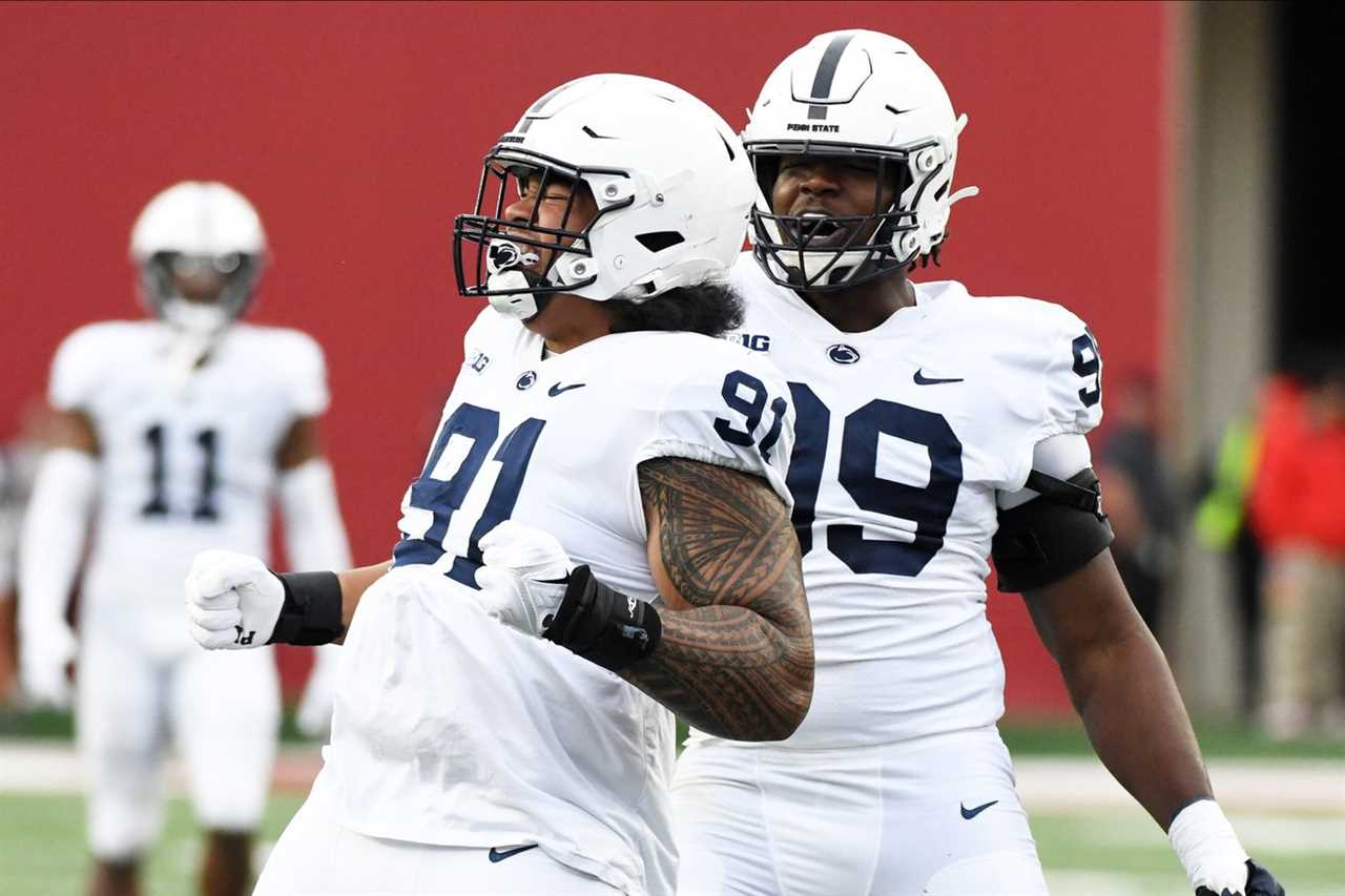 Nov 5, 2022; Bloomington, Indiana, USA; Penn State Nittany Lions defensive tackle Dvon Ellies (91) celebrates with Penn State Nittany Lions defensive tackle Coziah Izzard (99) after a sack during the first half at Memorial Stadium.