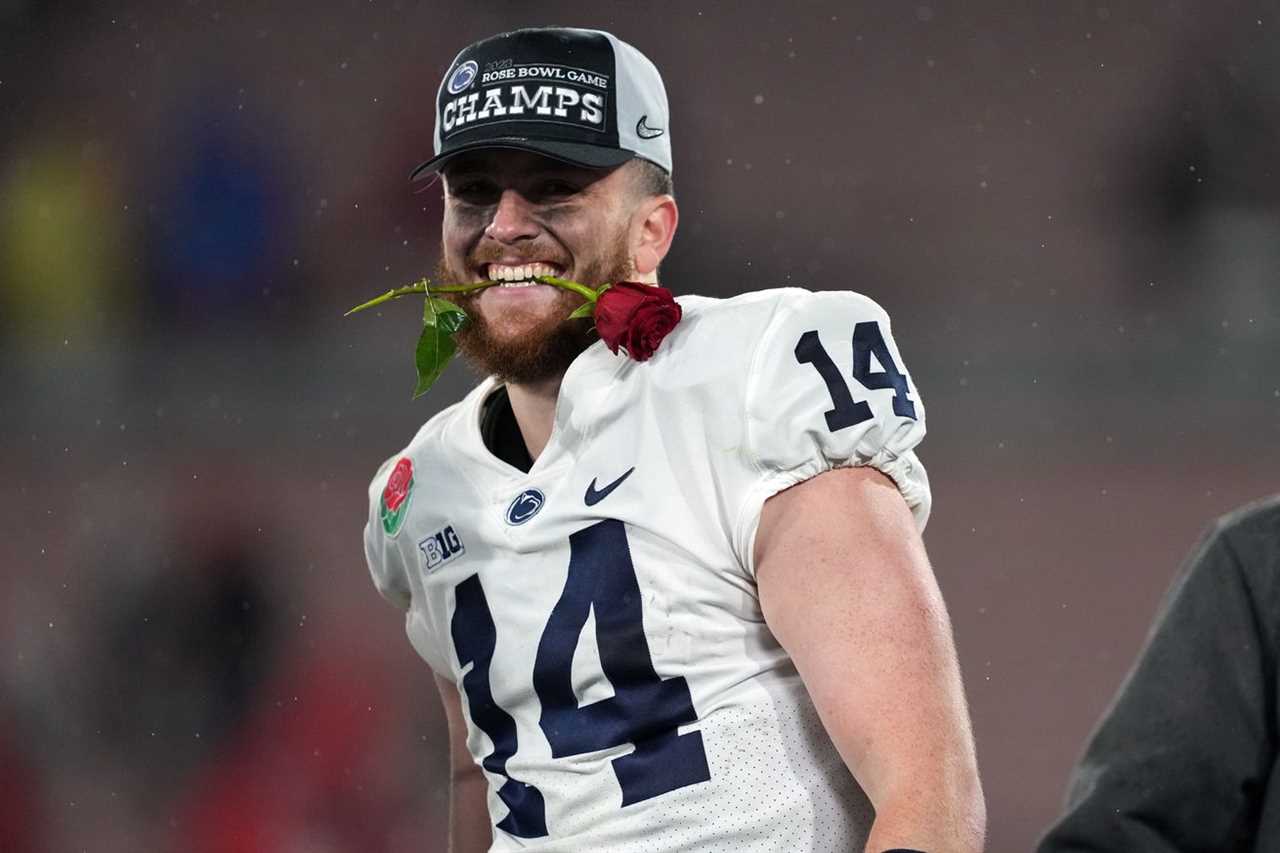 Jan 2, 2023; Pasadena, California, USA; Penn State Nittany Lions quarterback Sean Clifford (14) celebrates on the podium after the Penn State Nittany Lions defeated the Utah Utes in the 109th Rose Bowl game at the Rose Bowl.