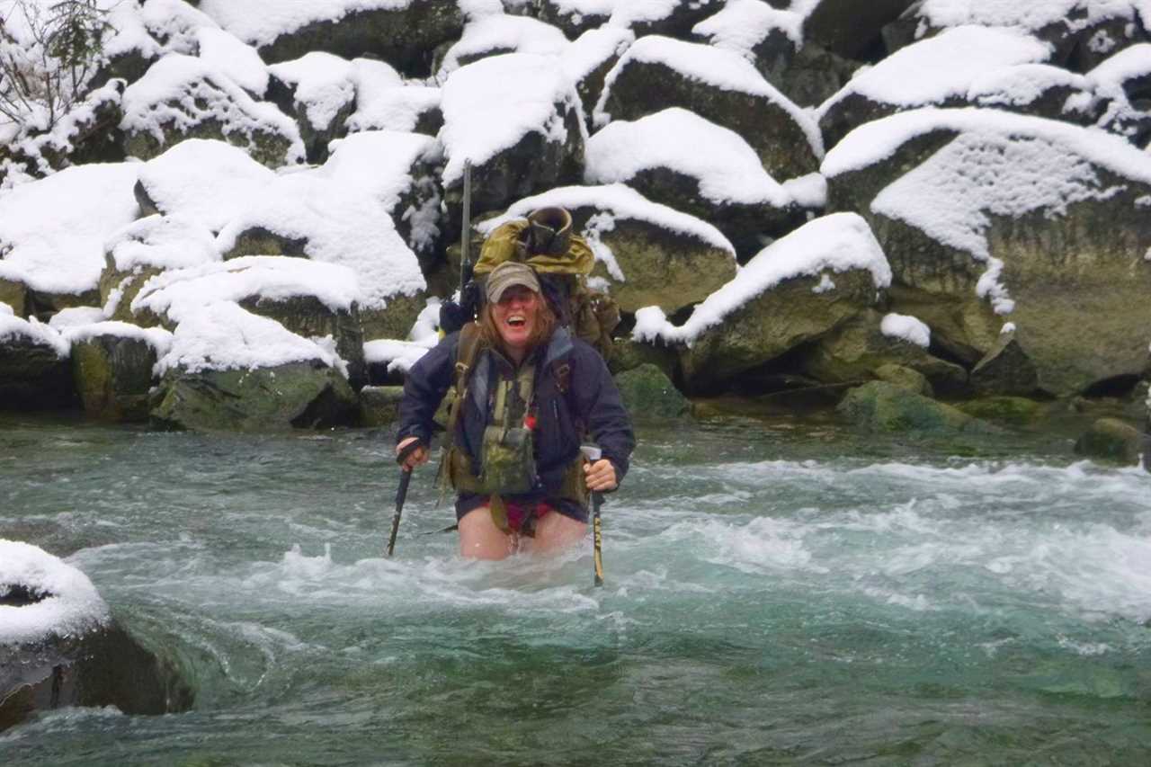 woman fording frigid water