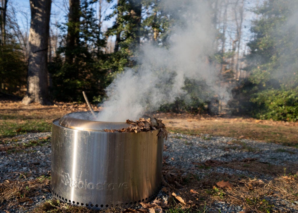 Smoke coming out of a silver fire pit