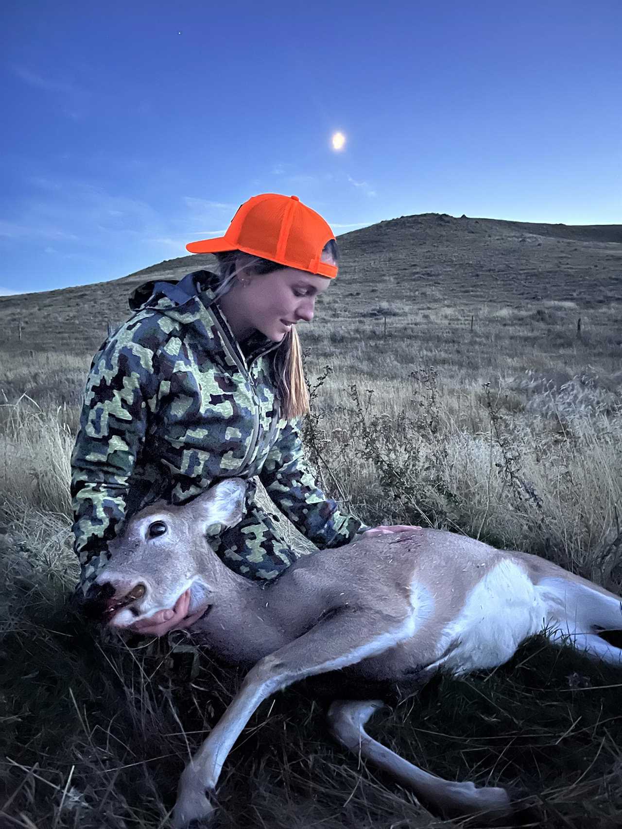 hunter holds deer