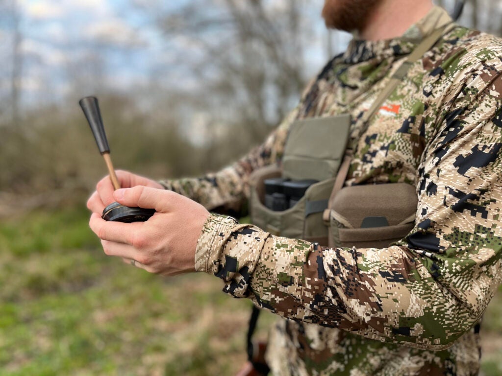 A turkey hunter with a bino harness