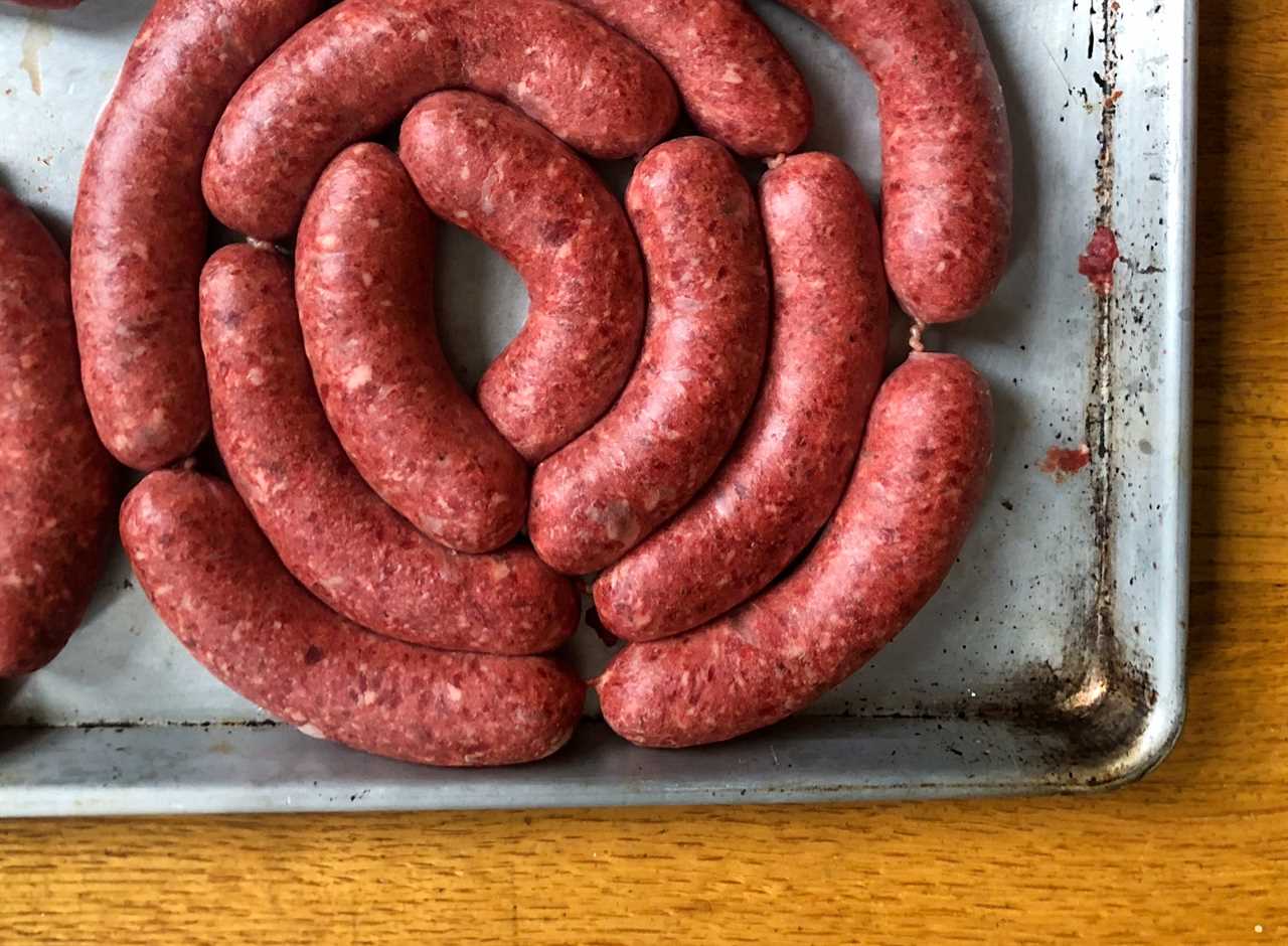 Venison sausage on a tray.