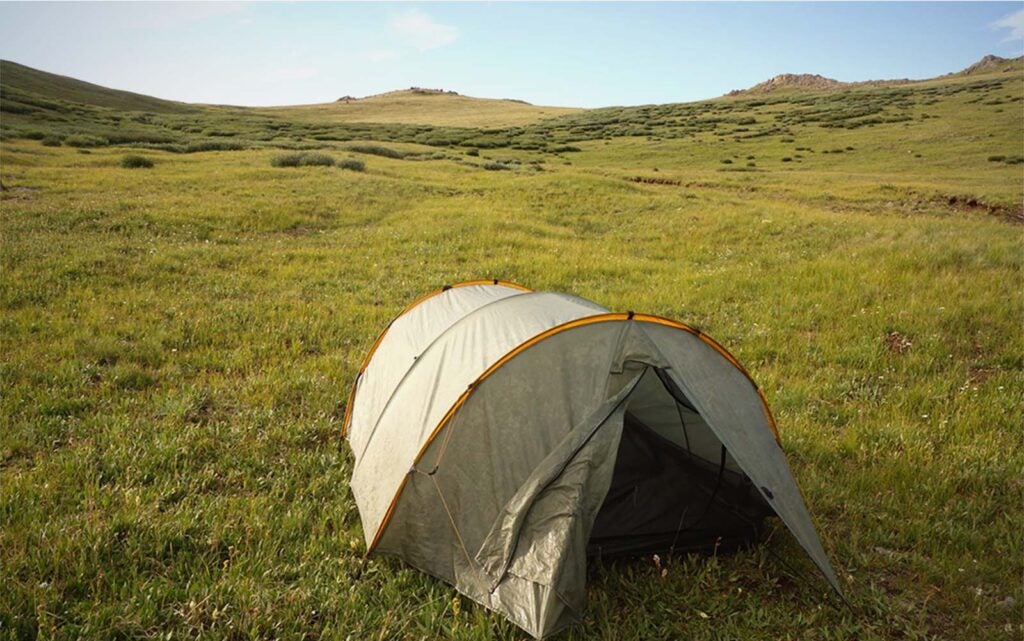 A green dome best backpacking tent in a field