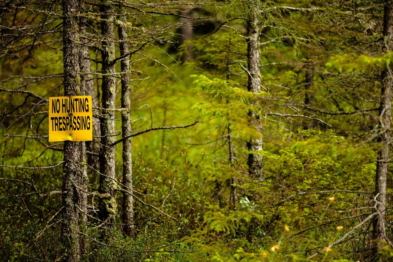 A no trespassing sign designed to prevent public access.