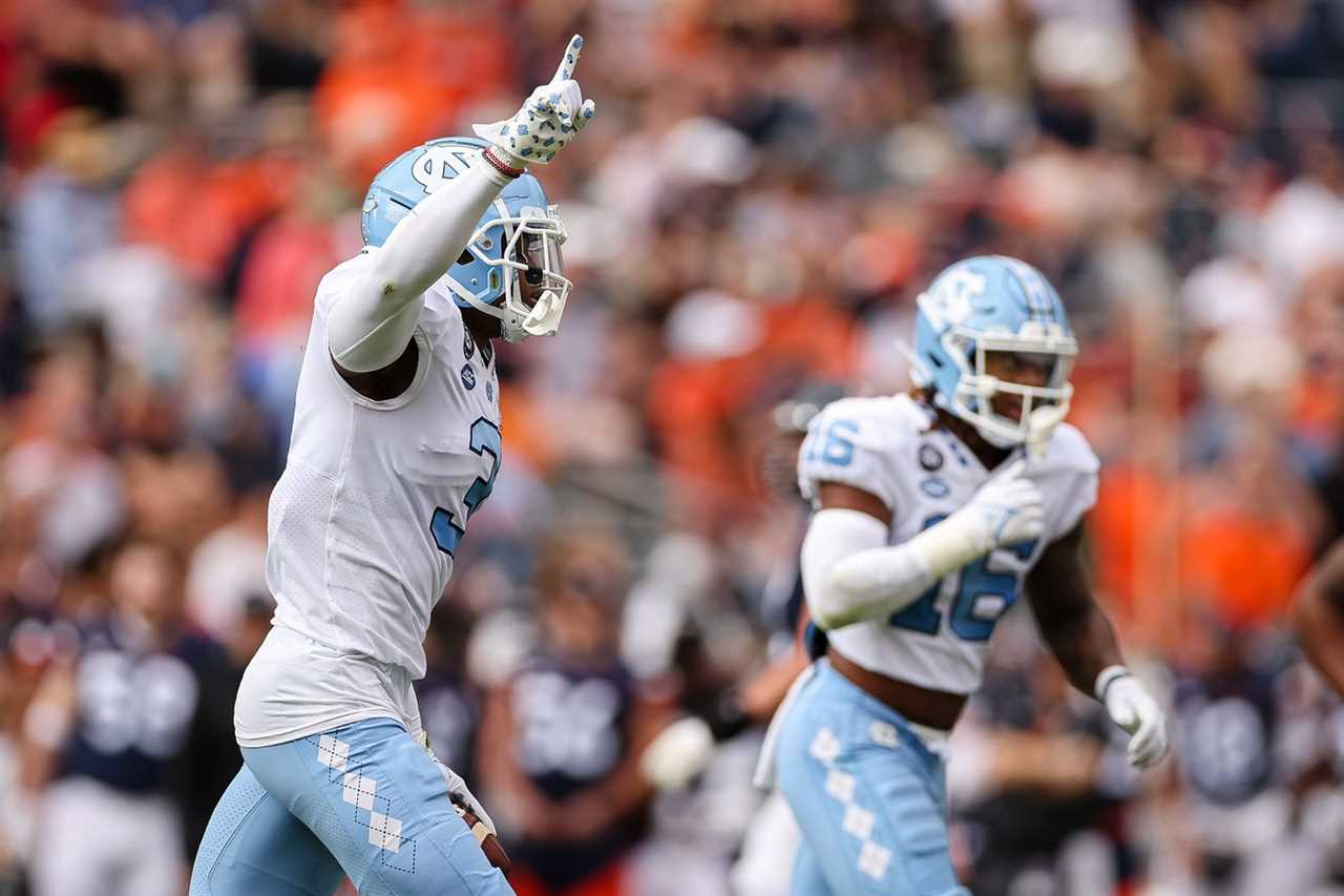 Nov 5, 2022; Charlottesville, Virginia, USA; North Carolina Tar Heels defensive back Storm Duck (3) celebrates after recording an interception against the Virginia Cavaliers during the first half at Scott Stadium.