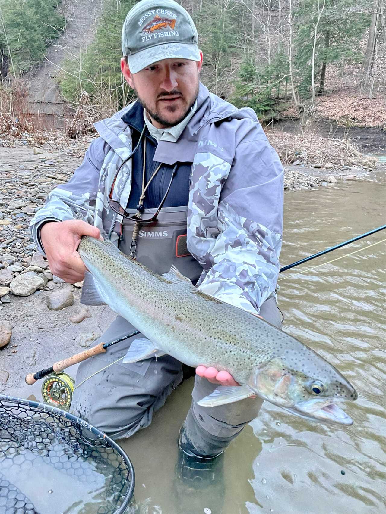 The author catches large fish while testing G3 waders.