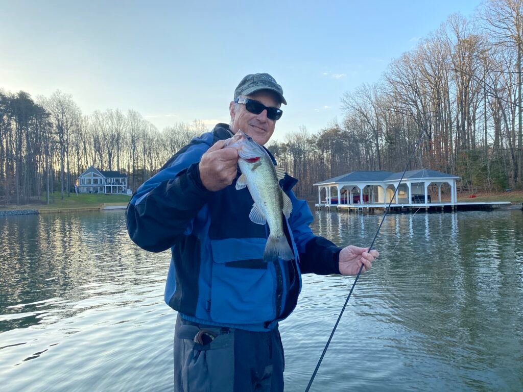 Angler holding bass