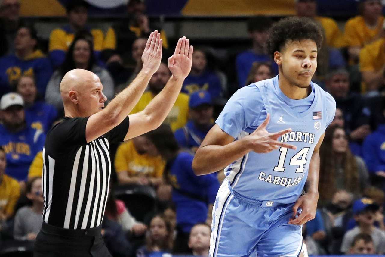 Dec 30, 2022; Pittsburgh, Pennsylvania, USA; North Carolina Tar Heels forward Puff Johnson (14) reacts after making a three point basket against the Pittsburgh Panthers during the first half at Petersen Events Center.