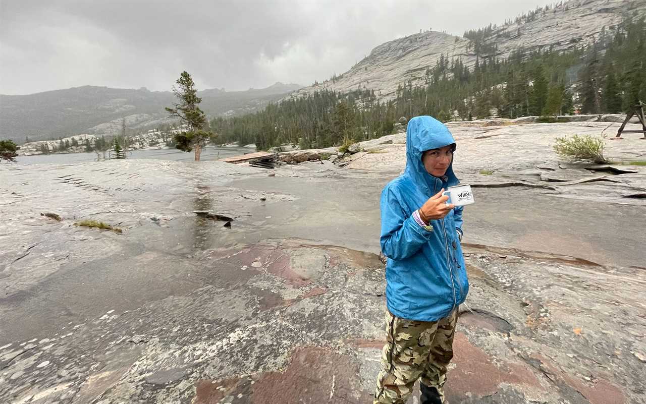 Woman wearing KUIU Chugach TR Rain Pants in the Wind River Range.