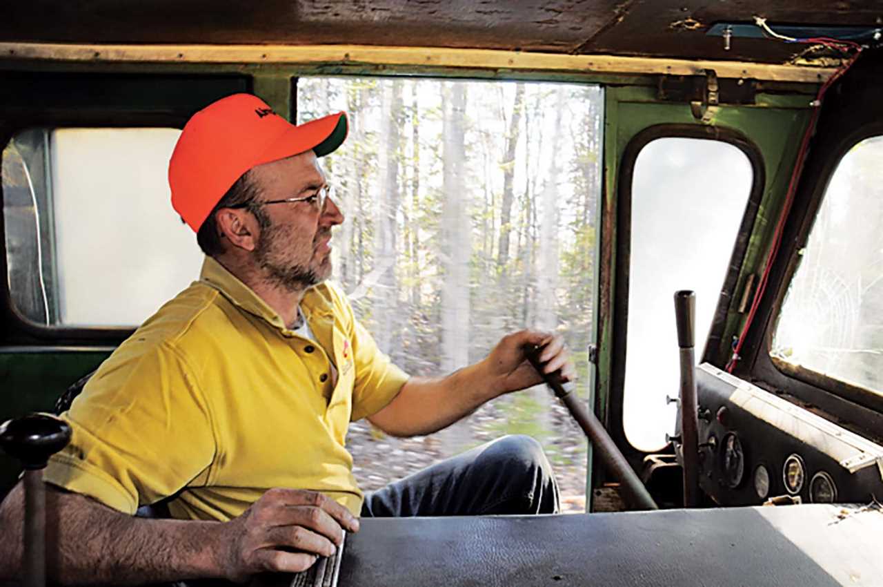 man inside tractor cabin