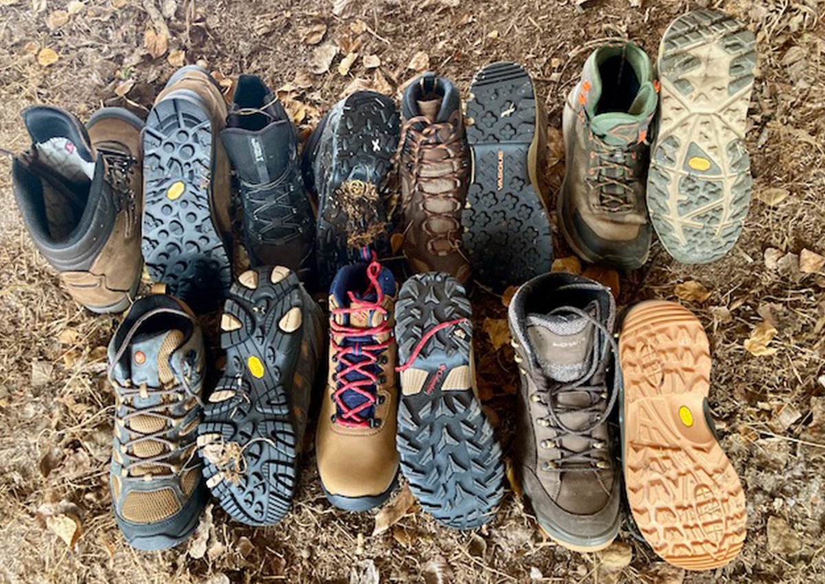The best hiking boots for men and their outsoles sit on the ground.