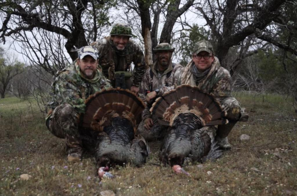 Four U.S. Marines on a turkey hunt in Texas