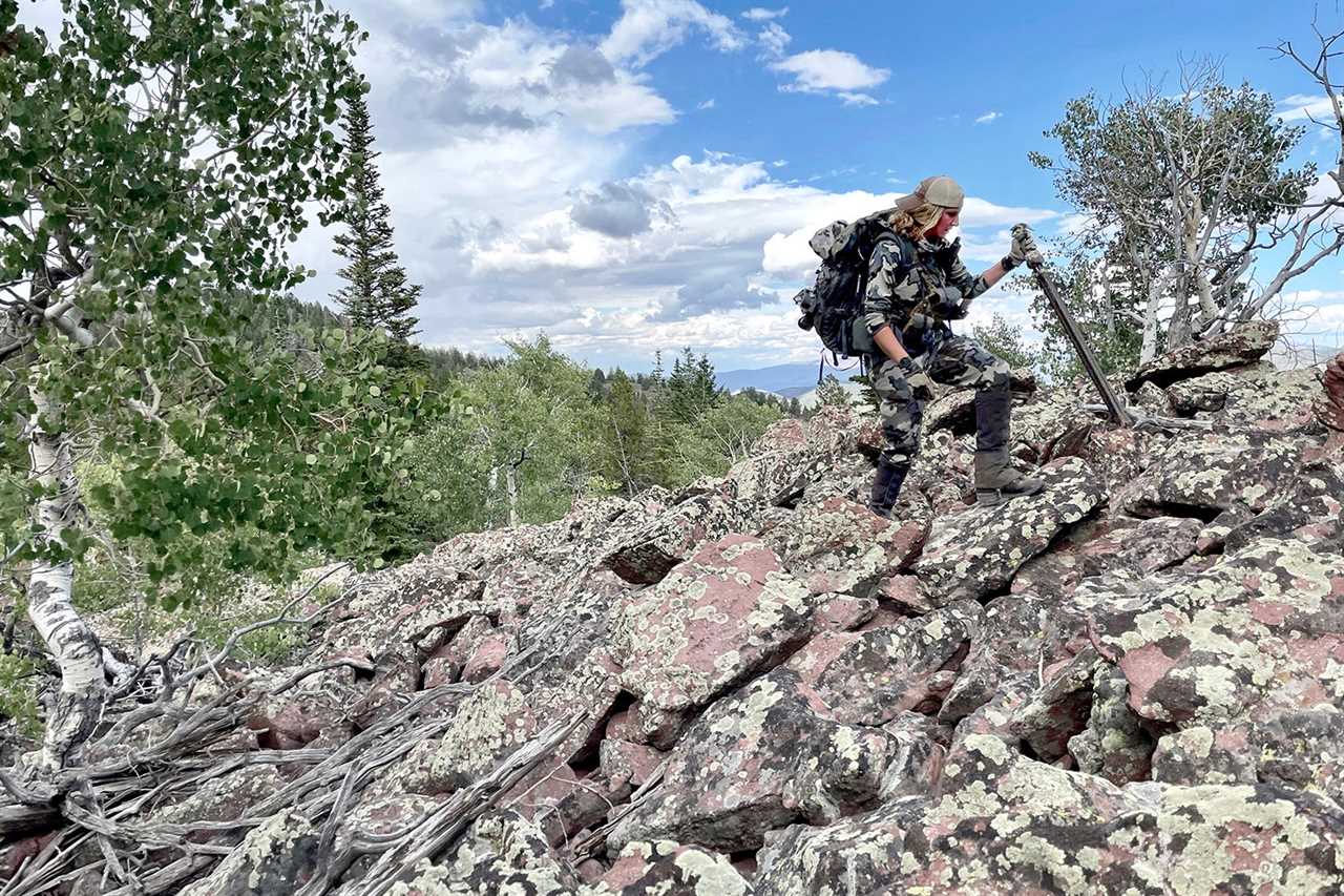 hunter hikes over rocks