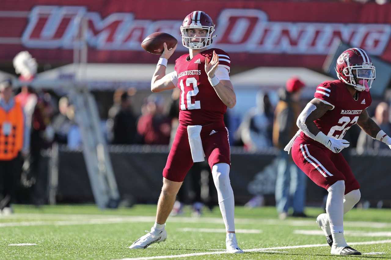 Nov 26, 2022; Amherst, Massachusetts, USA; Massachusetts Minutemen quarterback Brady Olson (12) passes the ball against the Army Black Knights during the first half at Warren McGuirk Alumni Stadium.