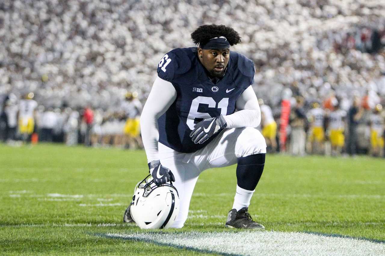 Oct 21, 2017; University Park, PA, USA; Penn State Nittany Lions offensive linemen C.J. Thorpe (61) kneels prior to the game against the Michigan Wolverines at Beaver Stadium.