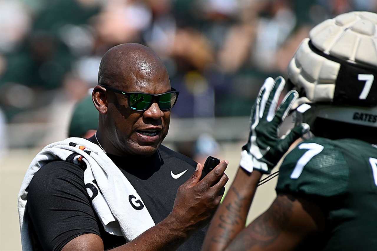 Michigan State Spartans head coach Mel Tucker talks with wide receiver Antonio Gates Jr. (7) during a scrimmage at Spartan Stadium.