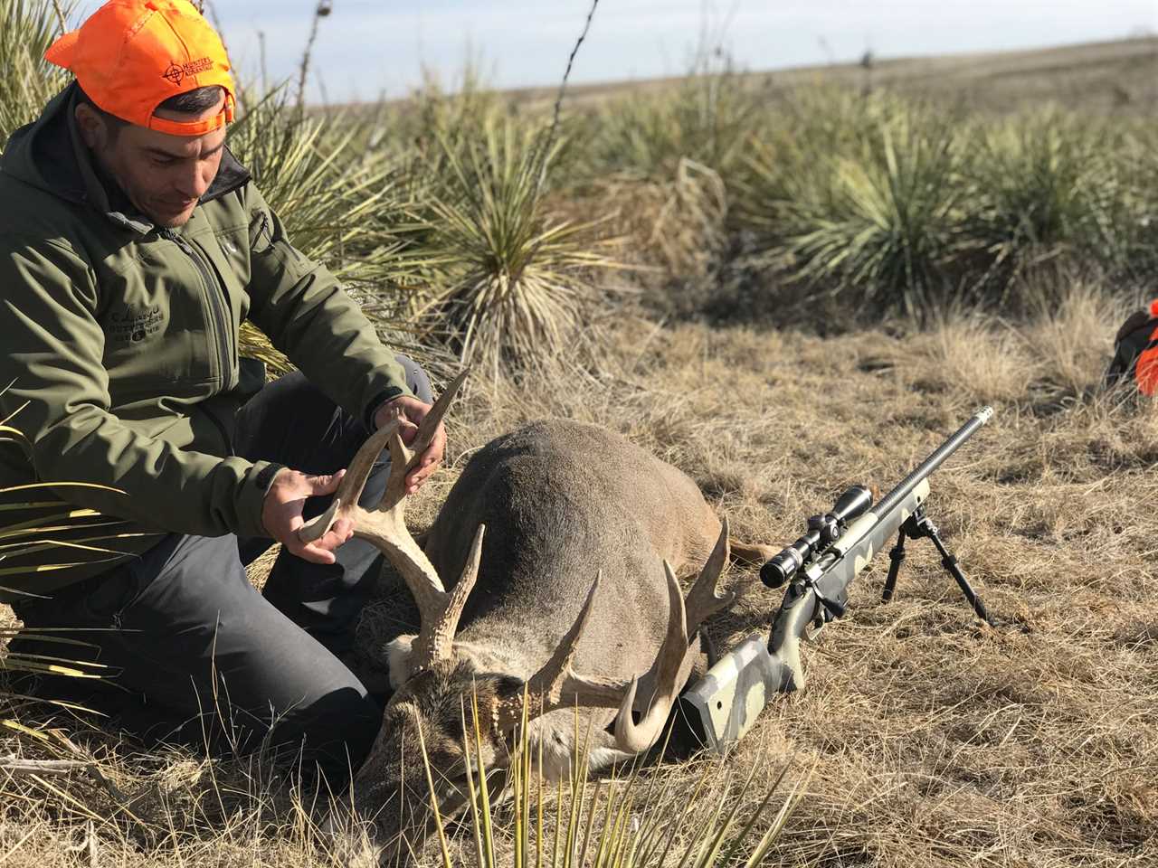 Cody Arnold with a heavy Colorado whitetail buck taken with a 6.5 PRC at 565 yards.