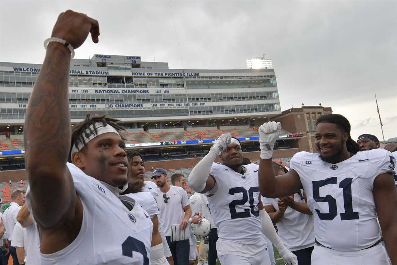 Penn State Nittany Lions players celebrate after defeating the Illinois Fighting Illini at Memorial Stadium.