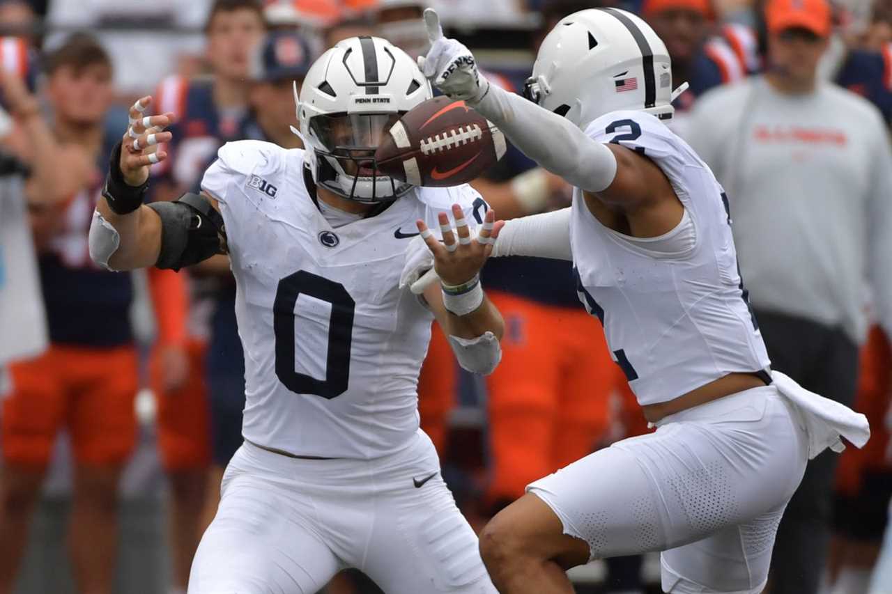 Penn State Nittany Lions linebacker Dominic DeLuca (0) and safety Keaton Ellis (2) break up a pass against the Illinois Fighting Illini during the second half at Memorial Stadium.