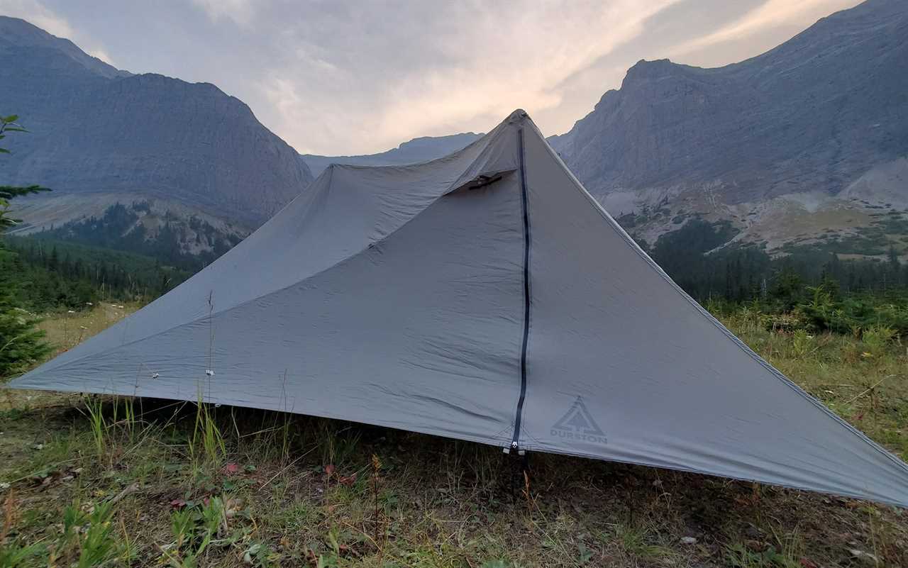 Insert the trekking poles inside the tent and extend until taught.