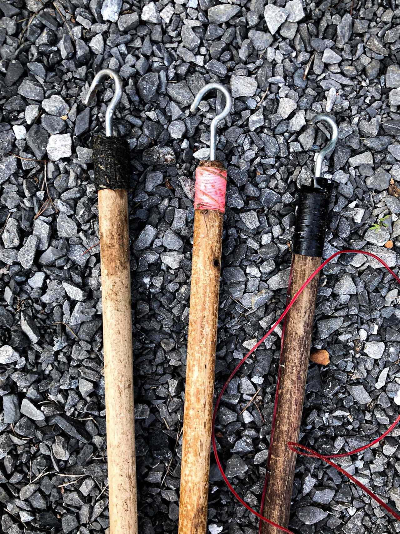 Dull hooks on top of noodling sticks.