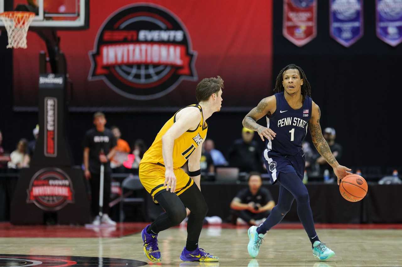 Penn State Nittany Lions guard Ace Baldwin Jr. (1) looks to pass the ball guarded by Virginia Commonwealth Rams guard Max Shulga (11) in the second half during the ESPN Invitational Events tournament seventh place game at State Farm Field House.